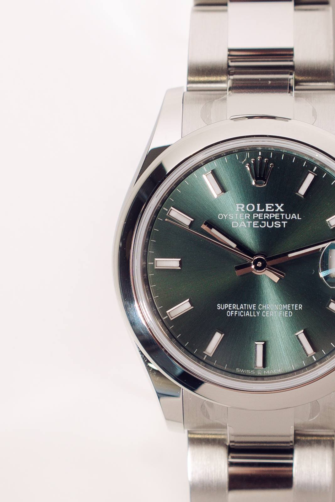 Close up of a Rolex Datejust mint green sunburst dial