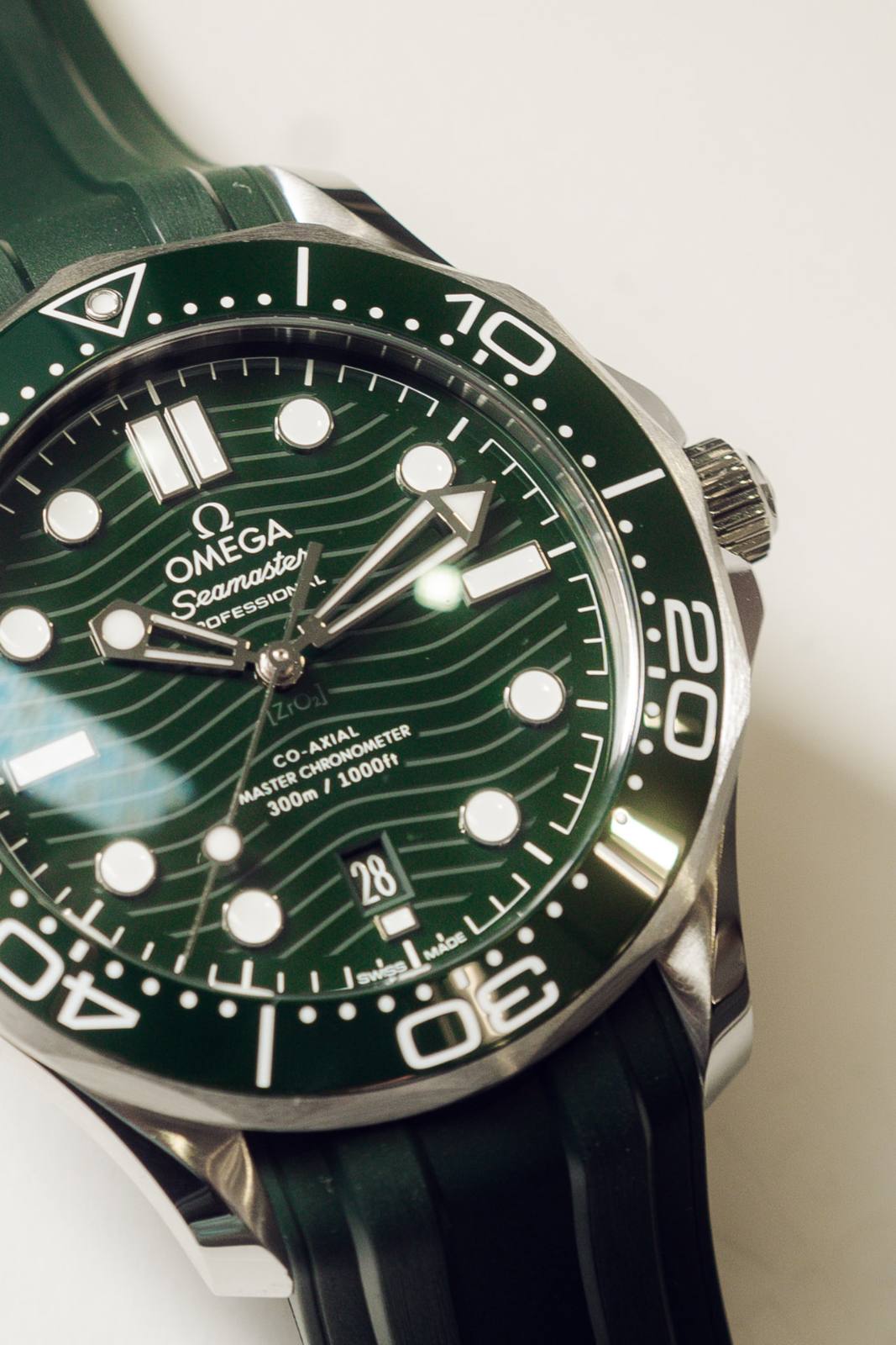Macro of the Omega Seamaster wave dial in green