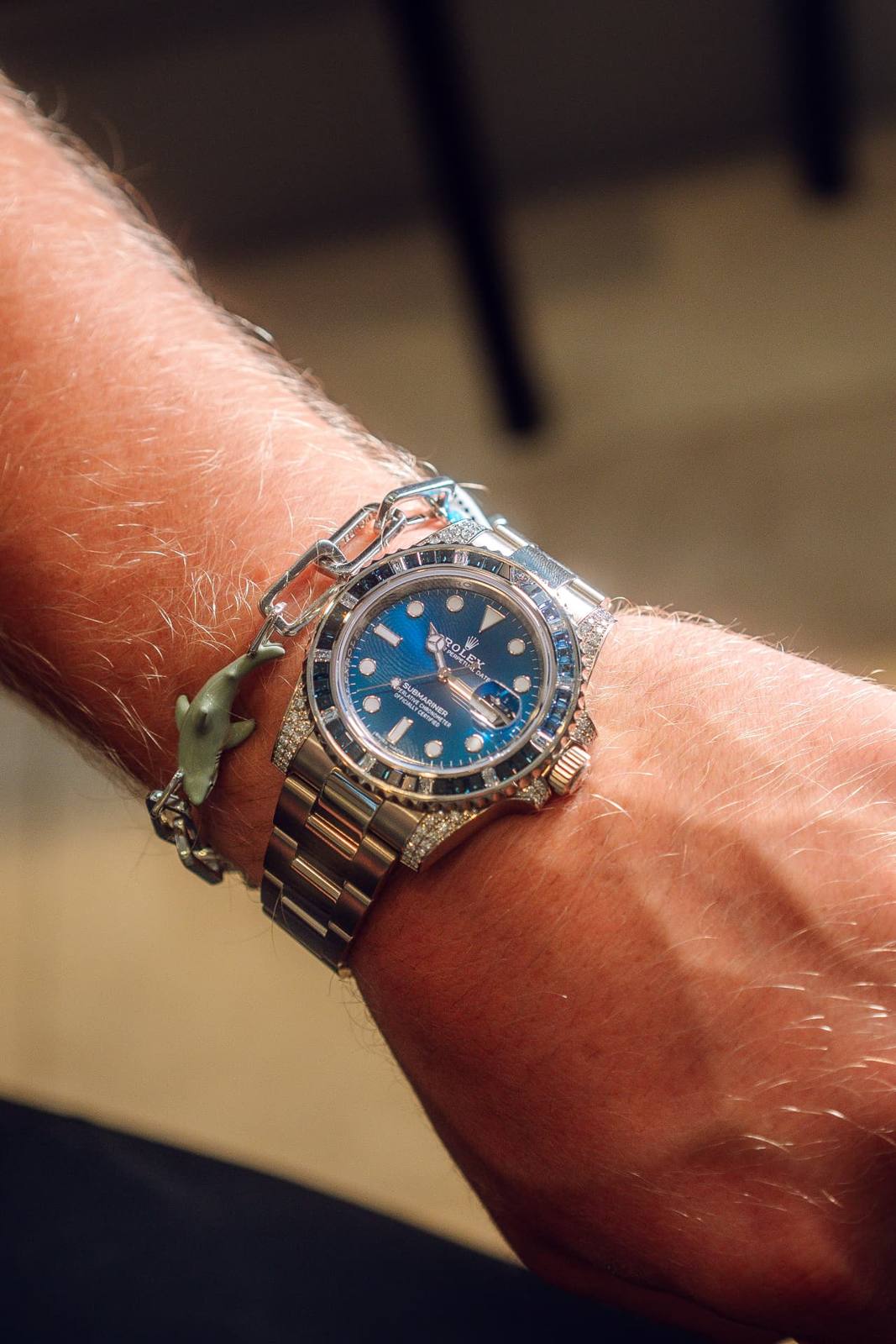 Diamond-set Rolex Submariner worn on the wrist
