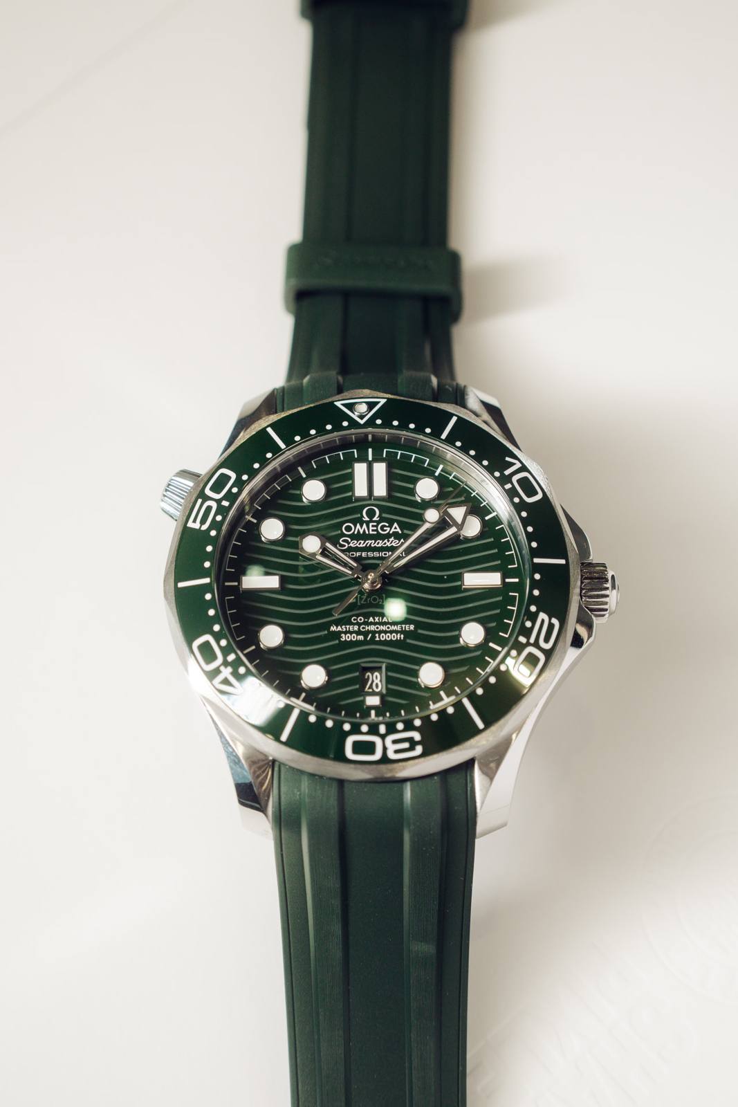 Omega Seamaster Diver 300M green dial on a green rubber strap