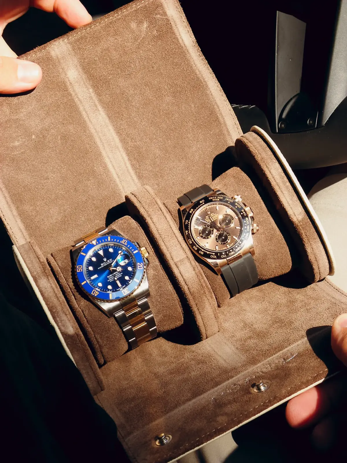 Two-tone Submariner and Everose Daytona in a suede watch roll
