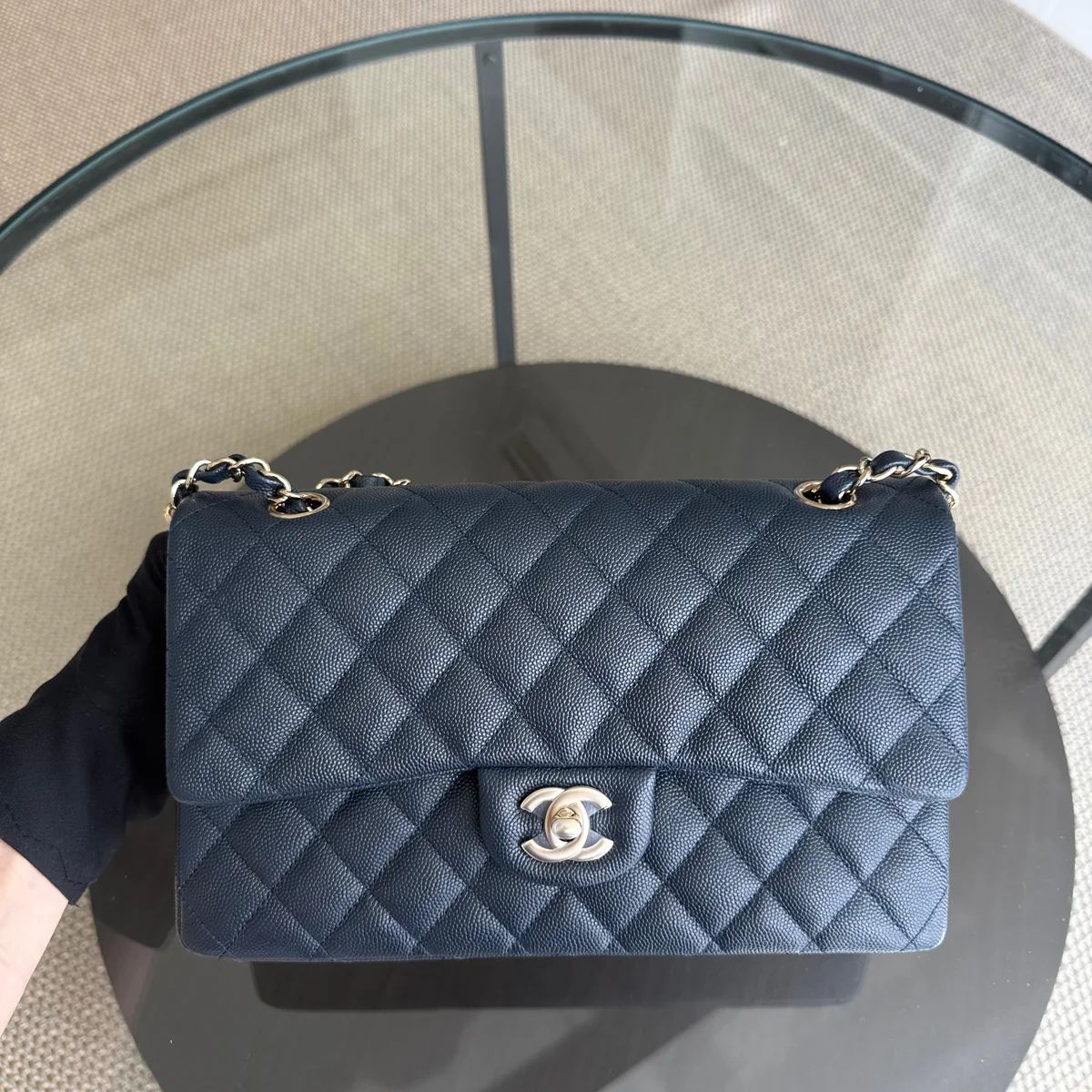 Chanel Classic Flap in navy caviar leather with light gold chain